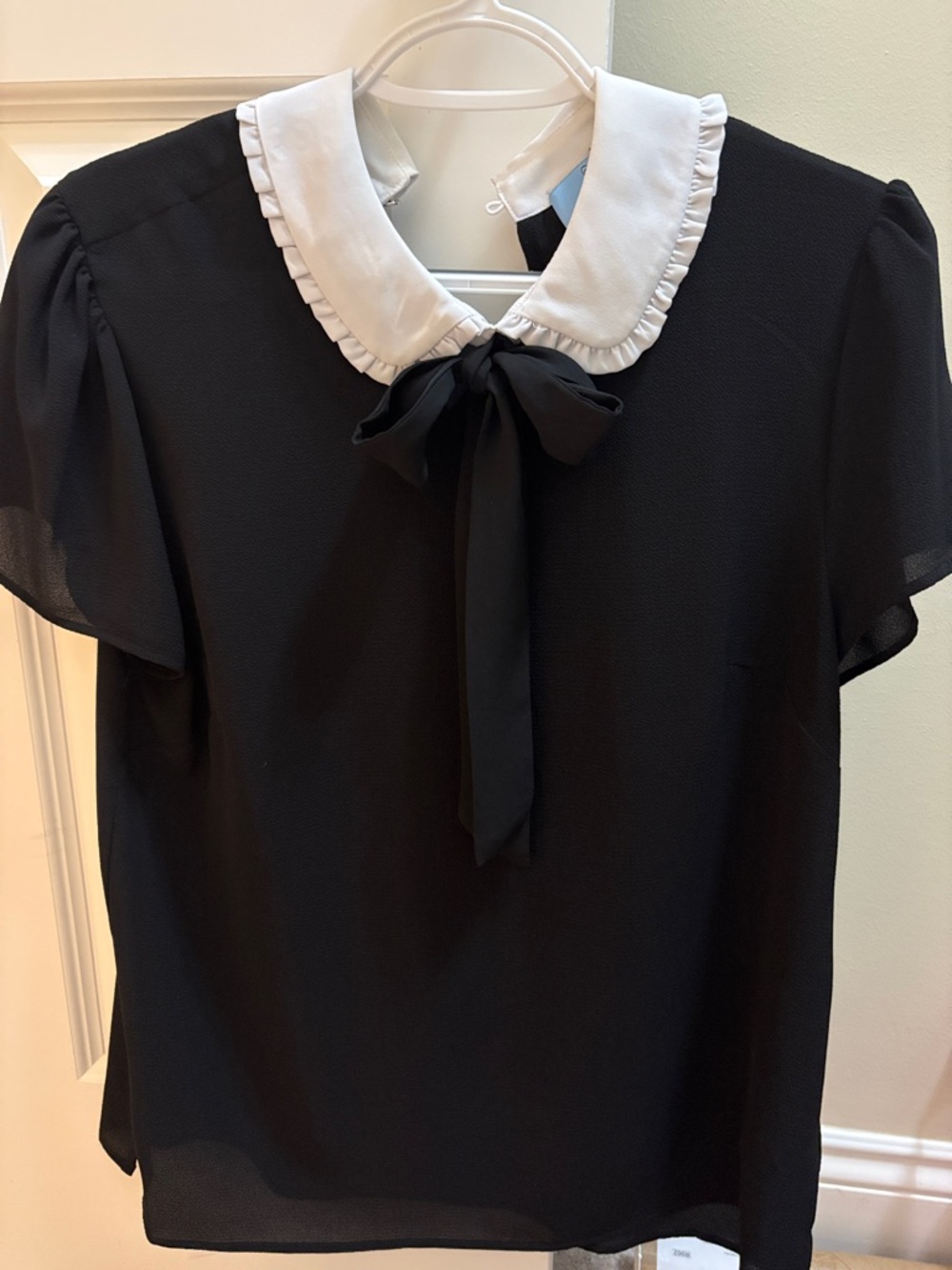 CeCe Black Blouse with White Ruffle Collar and Tie Neck